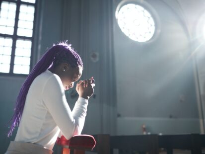 Woman praying in the church